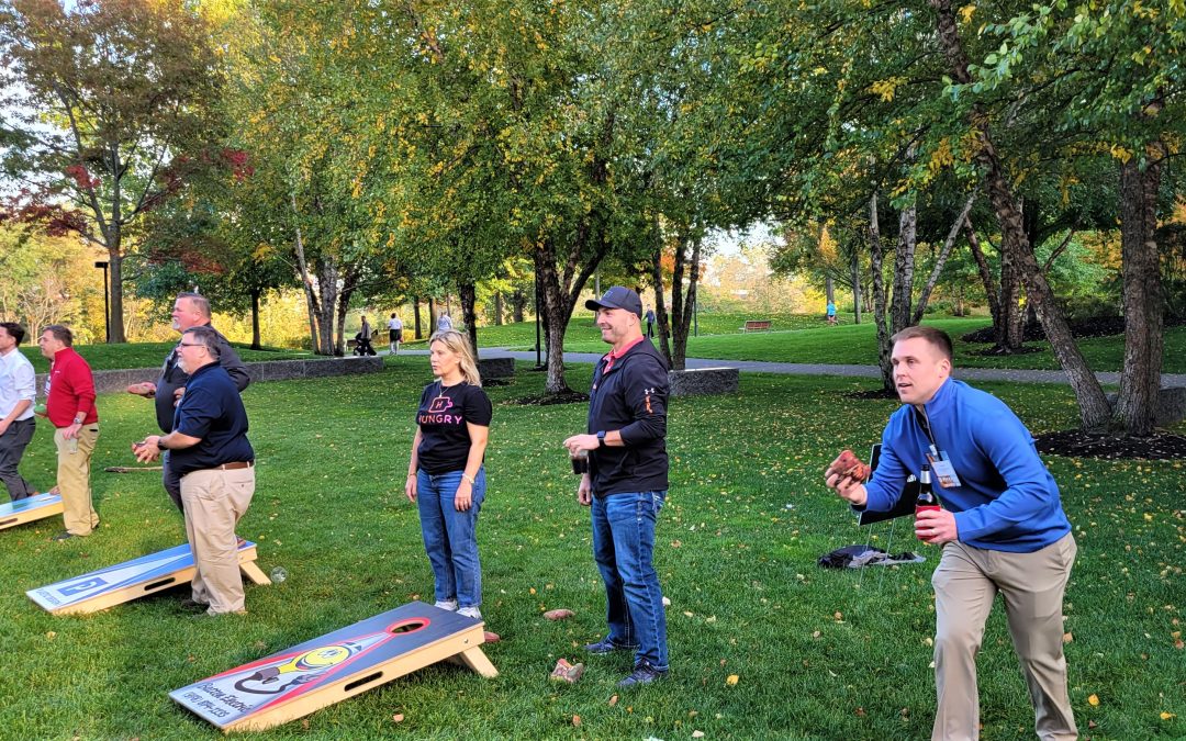 IFMA Boston Hosts 2nd Annual Cocktails and Cornhole at River’s Edge